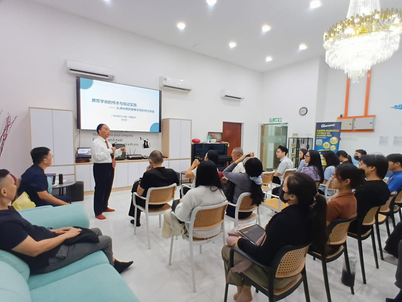 Professor Liu Youzhang presenting a TCM lecture to seated practitioners at AIM Healthcare in Subang Jaya.