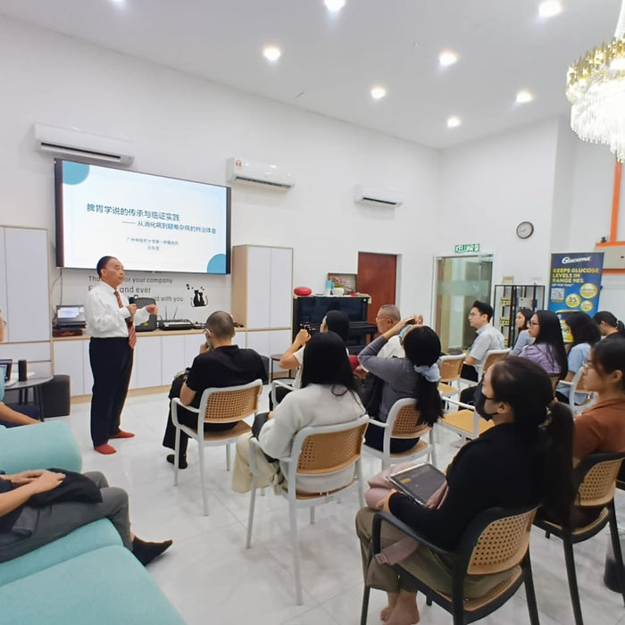 Professor Liu Youzhang presenting a TCM lecture to seated practitioners at AIM Healthcare in Subang Jaya.